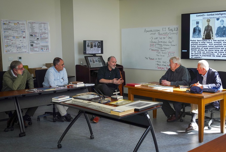 A group of people sitting at desks